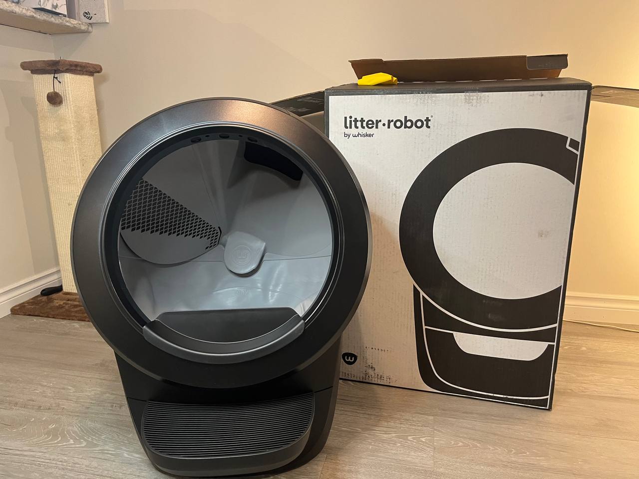 One more unpacked image of Litter Robot 4 device with the original box beside