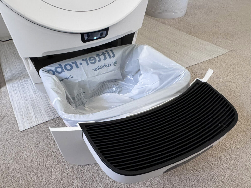 Litter Robot 5 Pro sitting on vinyl on top of carpet